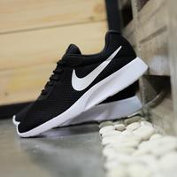simple black nike trainers