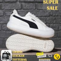 black white puma trainers