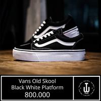 white and black platform vans