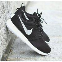 black roshe trainers
