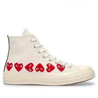 pink high top converse comme des garcons
