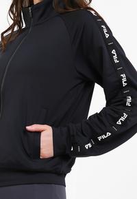 Gambar FILA Jaket Wanita Studio - Black - M dari FILA Official Store undefined 3 Tokopedia