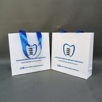 Gambar PAPERBAG IVORY PUTIH GLOSSY SABLON SKINCARE FREE DESAIN PXLXT 20X6X20 - PITA Lubang, 1 sisi 2 warna dari Berkah Bermartabat undefined 4 Tokopedia