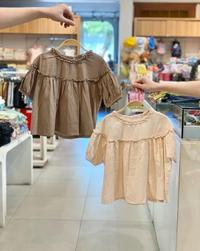 Gambar Blouse JYS Ruffle Plain 2 Colors - Macadamia Little Glamz dari Macadamia Little Glamz undefined 1 Tokopedia