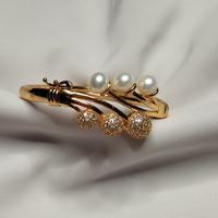 Gambar Gelang kaku/bangle mutiara - gold dari bale tenun undefined 1 Tokopedia