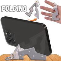 Gambar Gantungan Kunci Lipat Phone Holder Stand Smartphone Mini Lipat Anak dari Autoku undefined 1 Tokopedia