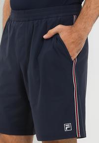 Gambar FILA  Celana Pendek Tennis Performance Pria Sydnee - Ink Navy - XL dari FILA Official Store undefined 5 Tokopedia