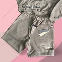Gambar Fear Of God Essentials Desert Taupe Hoodie & Shorts - Original 100% dari Sunshine Smiles undefined 3 Tokopedia