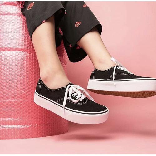 white and black platform vans