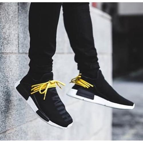 nmd human race black yellow