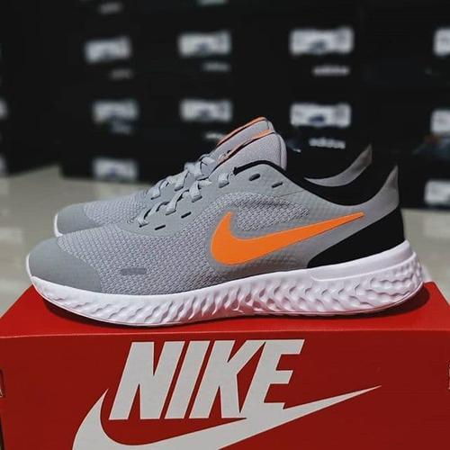 orange and grey nike revolution