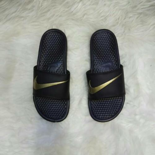 black nike shoes gold swoosh