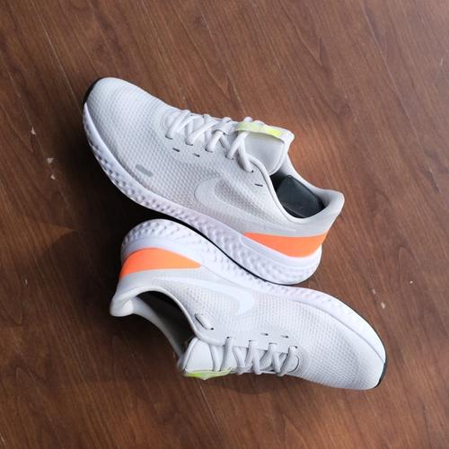orange and grey nike revolution
