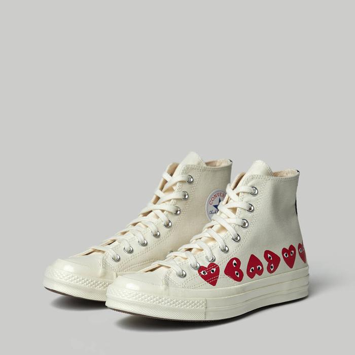 beige converse with heart