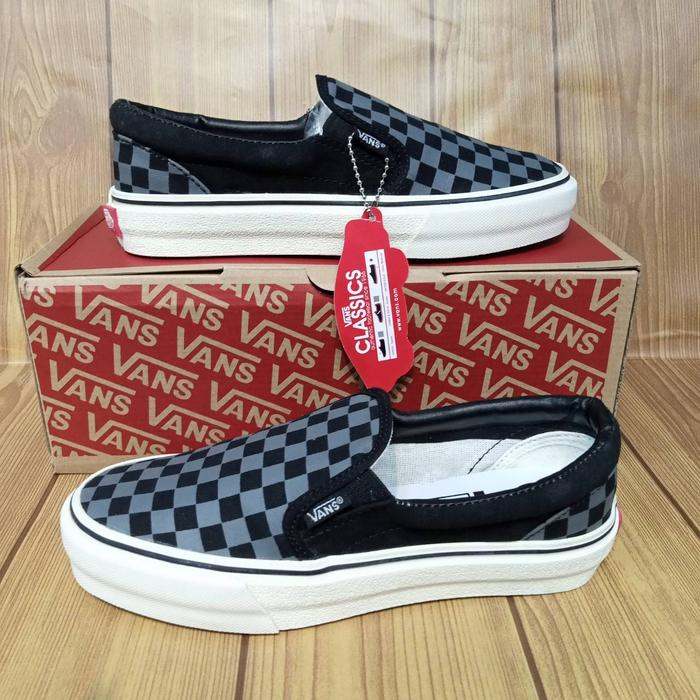 gray and black checkered slip on vans