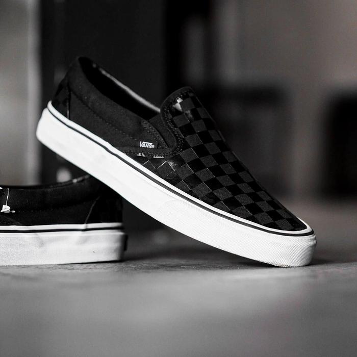 gray and black checkered slip on vans