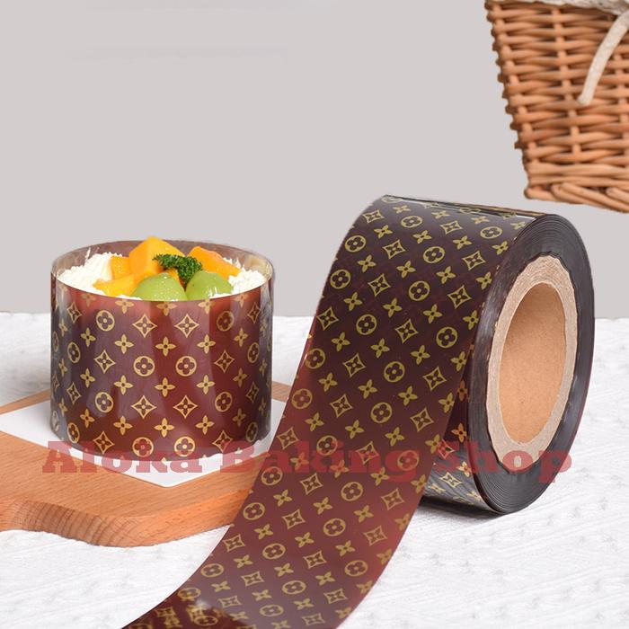 Gambar Plastik Mika Roll Pinggiran Cake / Kue / Tiramisu Motif LV 8cm x 5m - Cokelat dari Aloka Baking Shop undefined Tokopedia