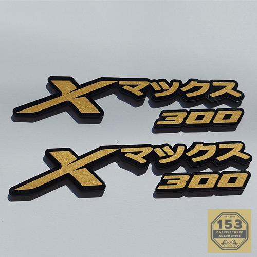 Gambar EMBLEM XMAX 300 2 PCS JAPAN 3D BADGE LOGO TIMBUL YAMAHA XMAX - GOLD dari OneFiveThree Automotive undefined Tokopedia