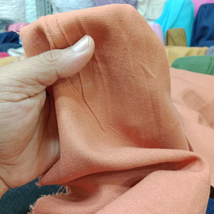 Gambar kain katun linen barbies polos - oren dari toko kain textile undefined Tokopedia