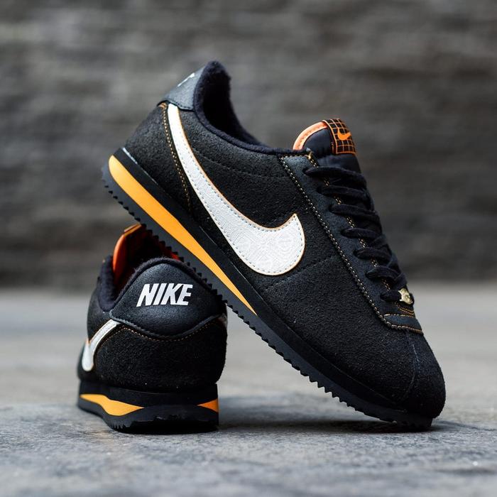 black and orange nike cortez